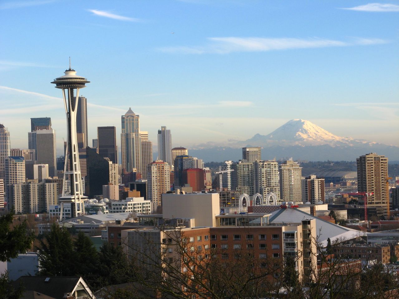 gallery-03 Stunning view of Seattle skyline featuring the Space Needle and Mount Rainier.